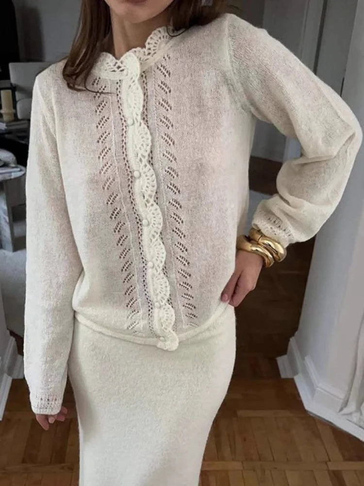 Fabric close-up revealing the dense knit structure and refined drape of the top.