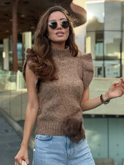 Fabric close-up revealing the fine knit texture and lightweight structure of the top.