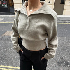 Casual weekday outfit featuring knitted pullover and minimalist accessories