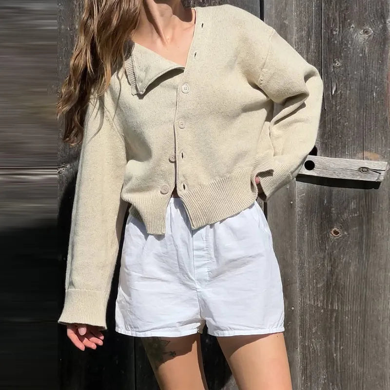 A close-up shot of the unique bevel buckle and the included scarf.