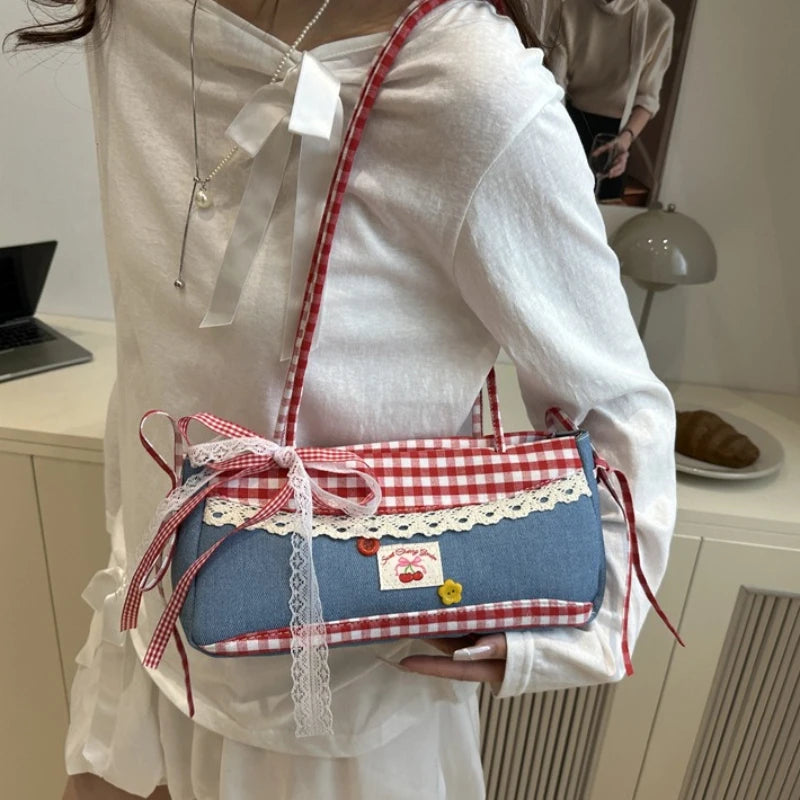 Blue and red plaid denim shoulder bag with lace bow trim