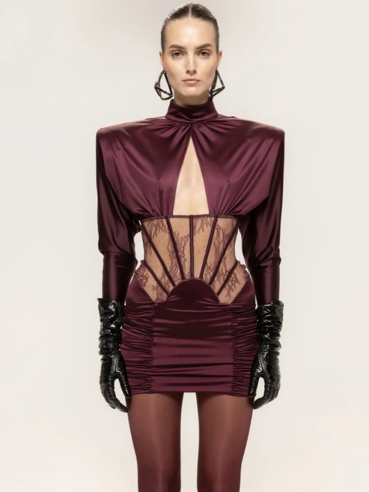 Mini dress featuring a sheer waist and lace corset details in burgundy