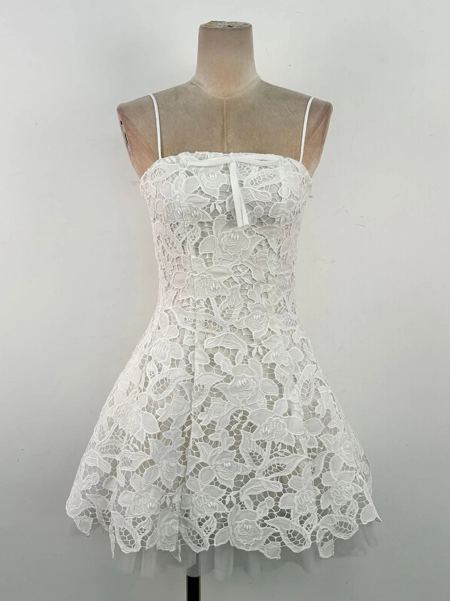 “Mini lace dress styled for summer party with heels and bag”

