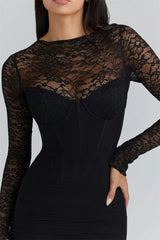 Close-up of the lace neckline and sleeve texture showing the delicate pattern and subtle sweetheart shaping underneath.
