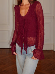 Lace long sleeve blouse styled casually with jeans for a relaxed, vintage-inspired look.