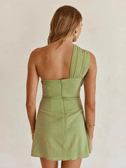 One-shoulder mini dress showing open-back lace-up detail