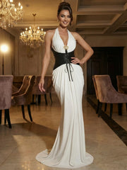 Close-up of the lace-up waist detail on a halter sheath dress