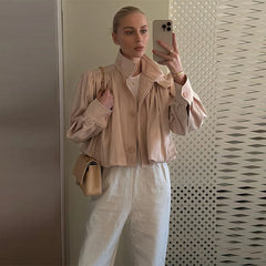 The full-length view of the jacket, highlighting its stylish lantern sleeves.