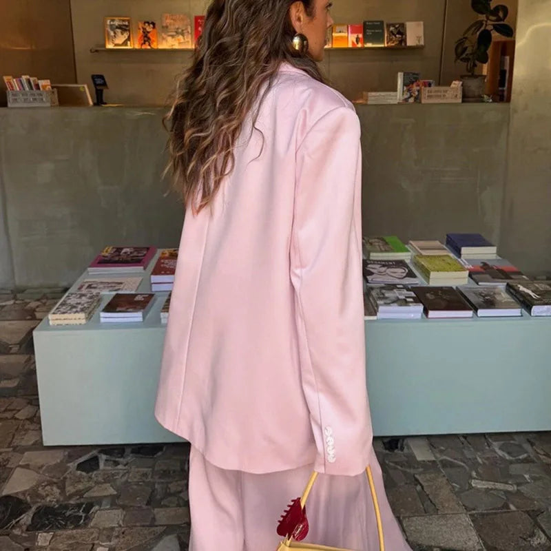 A front view of a long-sleeve blazer and skirt, highlighting the elegant silhouette.