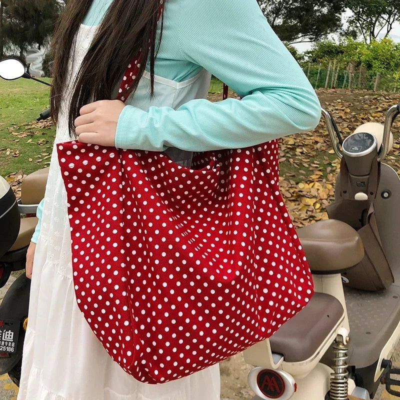 Oversized dotted shoulder handbag with two handles