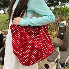 Oversized dotted shoulder handbag with two handles