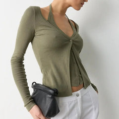 Detail view highlighting the overlapping layers and slim fit through the waist.