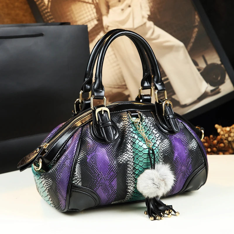 Leather dumpling handbag with serpentine pattern and tassel