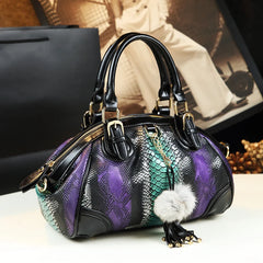 Leather dumpling handbag with serpentine pattern and tassel