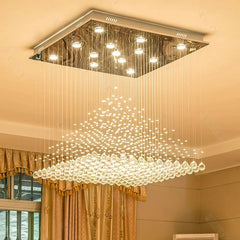 LED cascading crystal chandelier floating in a large foyer