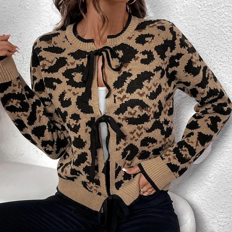 A woman wearing a cozy leopard print sweater in a loose-fitting silhouette.