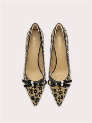 Leopard print pointed-toe pumps with pearl bow detail on the front