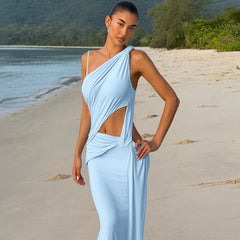 Light blue asymmetric cut-out maxi dress styled on the beach