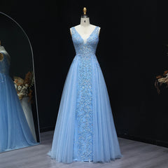 Beaded illusion V-neck A-line floor-length prom gown on mannequin