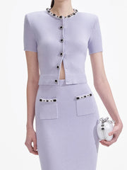 Short sleeve top paired with elastic-waist midi skirt in a coordinated look