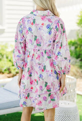 Lightweight boho floral mini dress styled for warm weather

