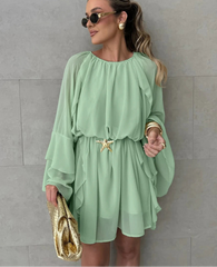 Lightweight spring above knee dress shown for photogenic seasonal style