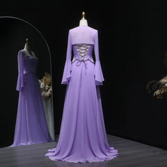 Floor-length formal dress with long sleeves and sweep train against dark backdrop