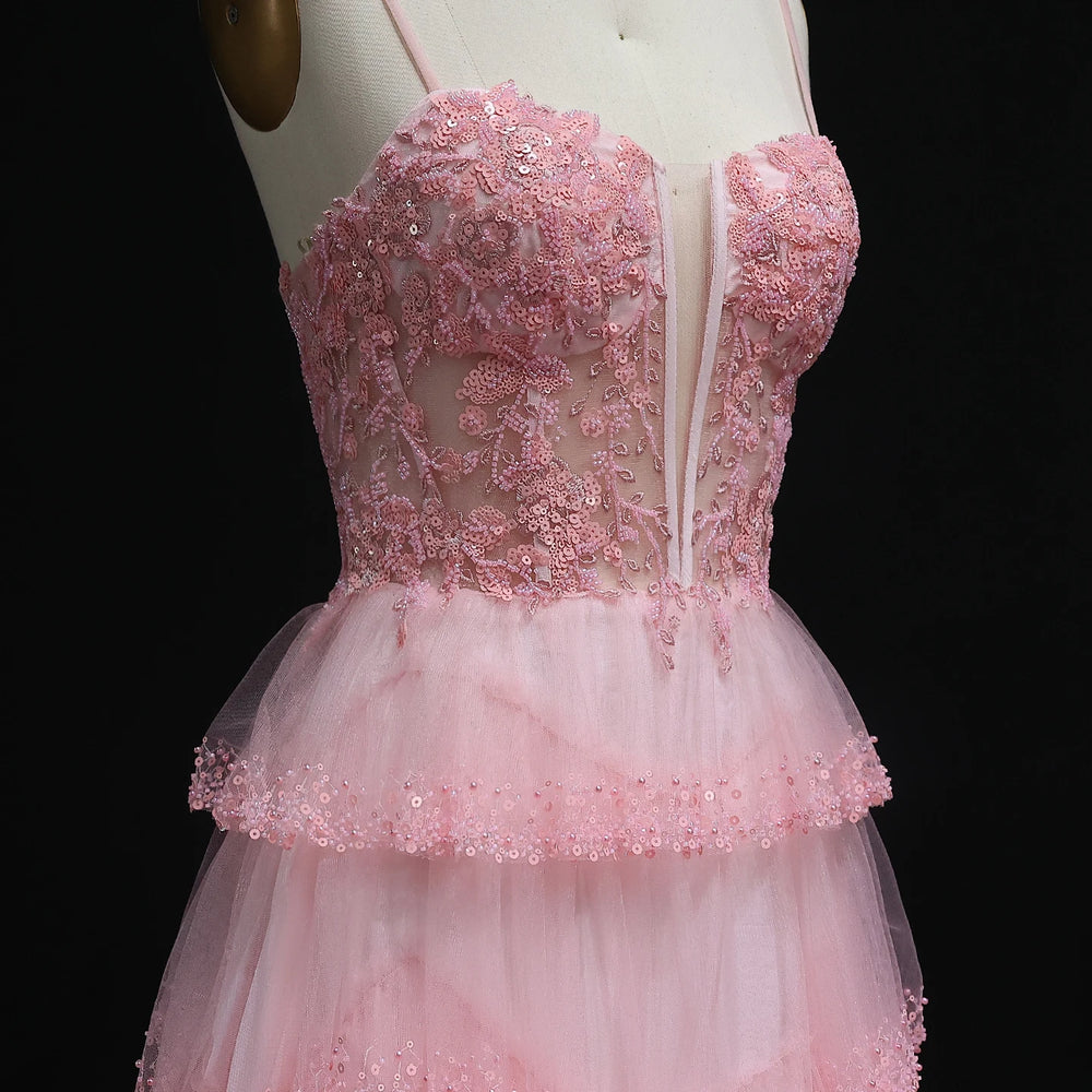 Close-up of illusion corset bodice with appliqué detail on tulle gown