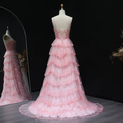 Sweep train detail on tiered ruffle tulle prom dress