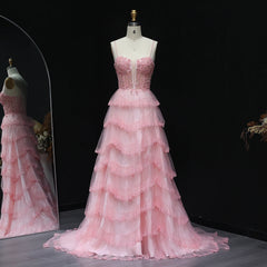 Tiered ruffle tulle A-line prom gown with sweetheart neckline on mannequin