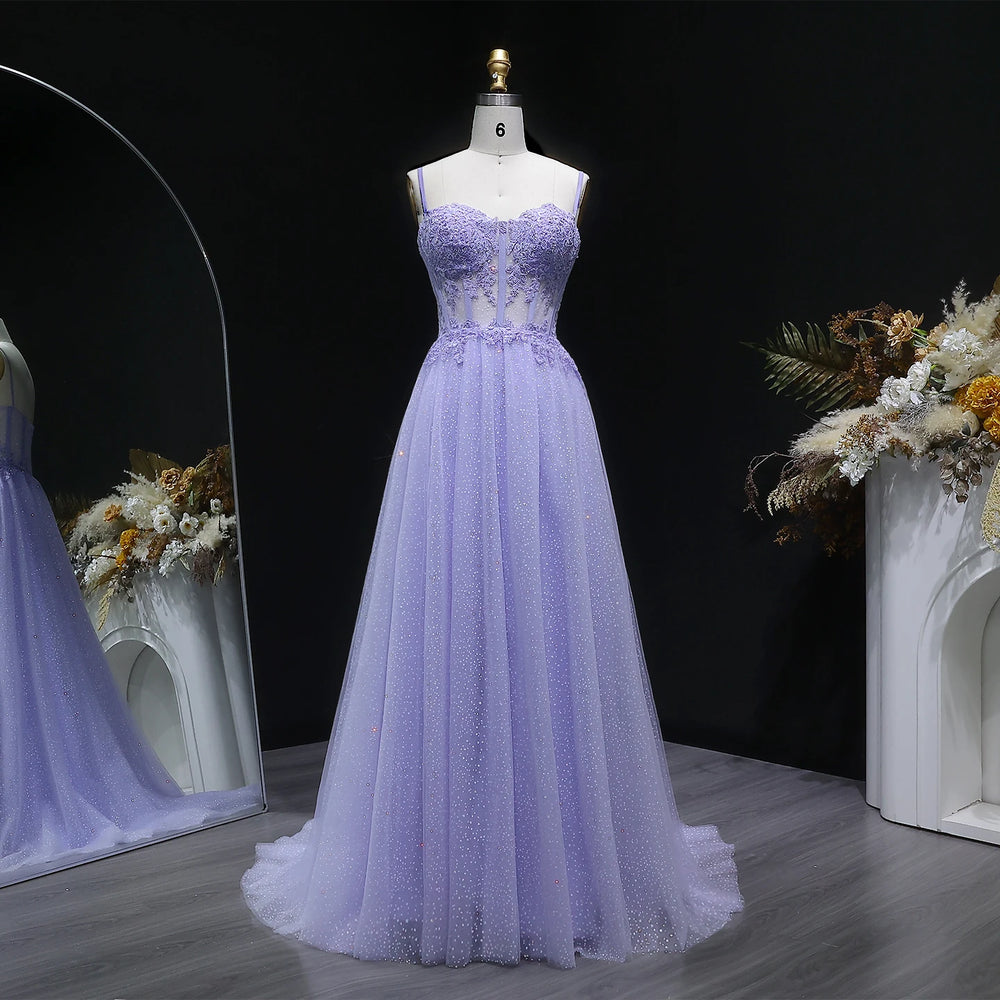 Lilac tulle A-line prom gown with spaghetti straps on mannequin