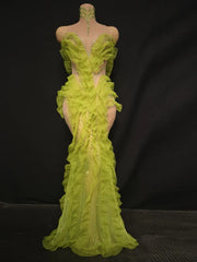 Side angle showing the body-skimming fit and dramatic ruffle cascade on a lime green statement gown designed for spotlight evenings.