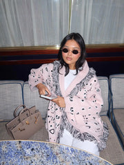 Styled layered outfit with the long knit cardigan worn open over a simple top and jeans for an easy, polished look.