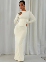 Long sleeve bodycon maxi dress shown from the front, highlighting the clean O-neckline and elongated, sculpted silhouette.
