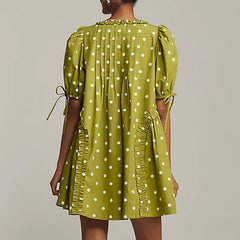 A loose A-line summer dress styled casually for a weekend outing.