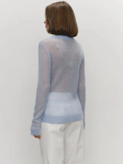 Lightweight textured knit pullover sweater top with relaxed drape and ribbed cuffs