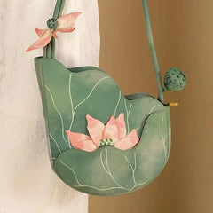 Lotus leaf shaped green handbag with pink floral design
