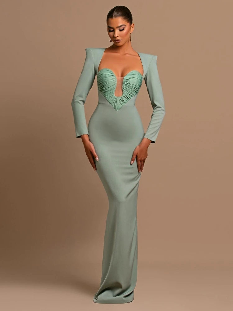 A woman wearing a low-cut bodycon maxi dress in a chic, modern style.