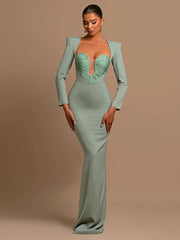 A woman wearing a low-cut bodycon maxi dress in a chic, modern style.