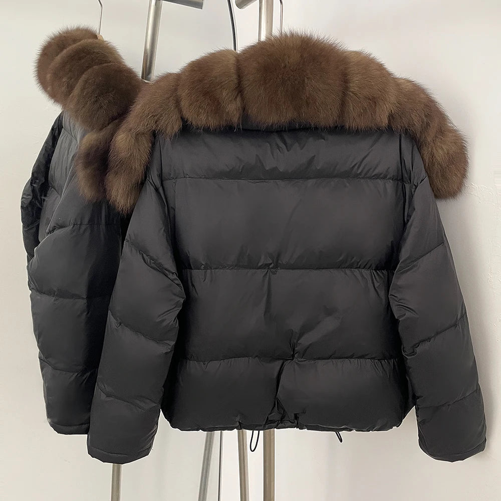 Natural fox fur collar detail on a thick winter puffer coat.