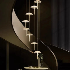 Luxury foyer pendant lighting with modern gold and crystal discs