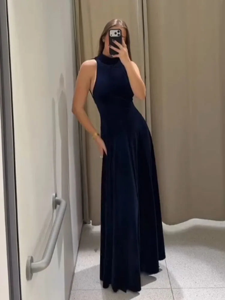 Close-up of halter neckline and velvet texture on maxi dress