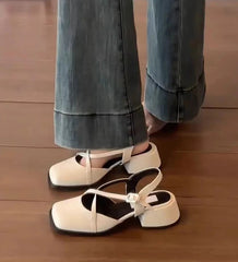 Mary Jane slingback heels with cross buckle strap worn with denim