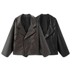 Matte leather high street autumn coat layered with trousers