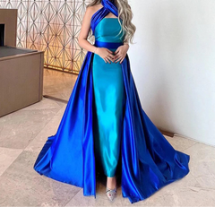 Contrast blue overskirt effect flowing from the waist over a fitted turquoise mermaid base.