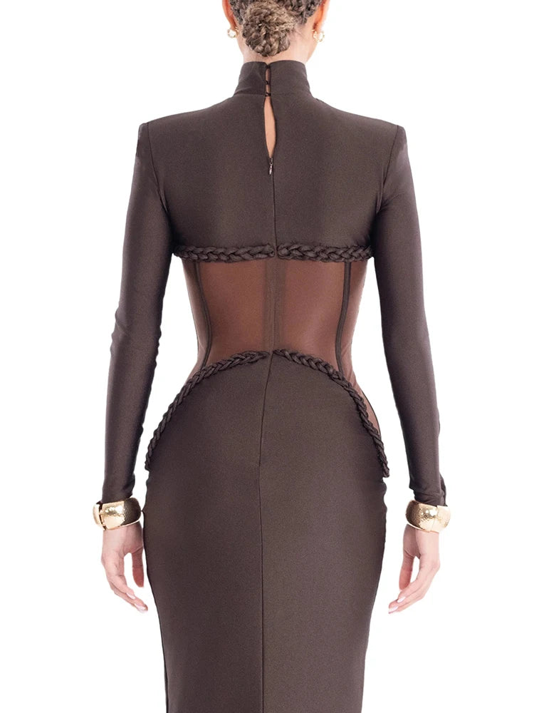 A close-up of the sheer mesh patchwork detail on the brown dress.