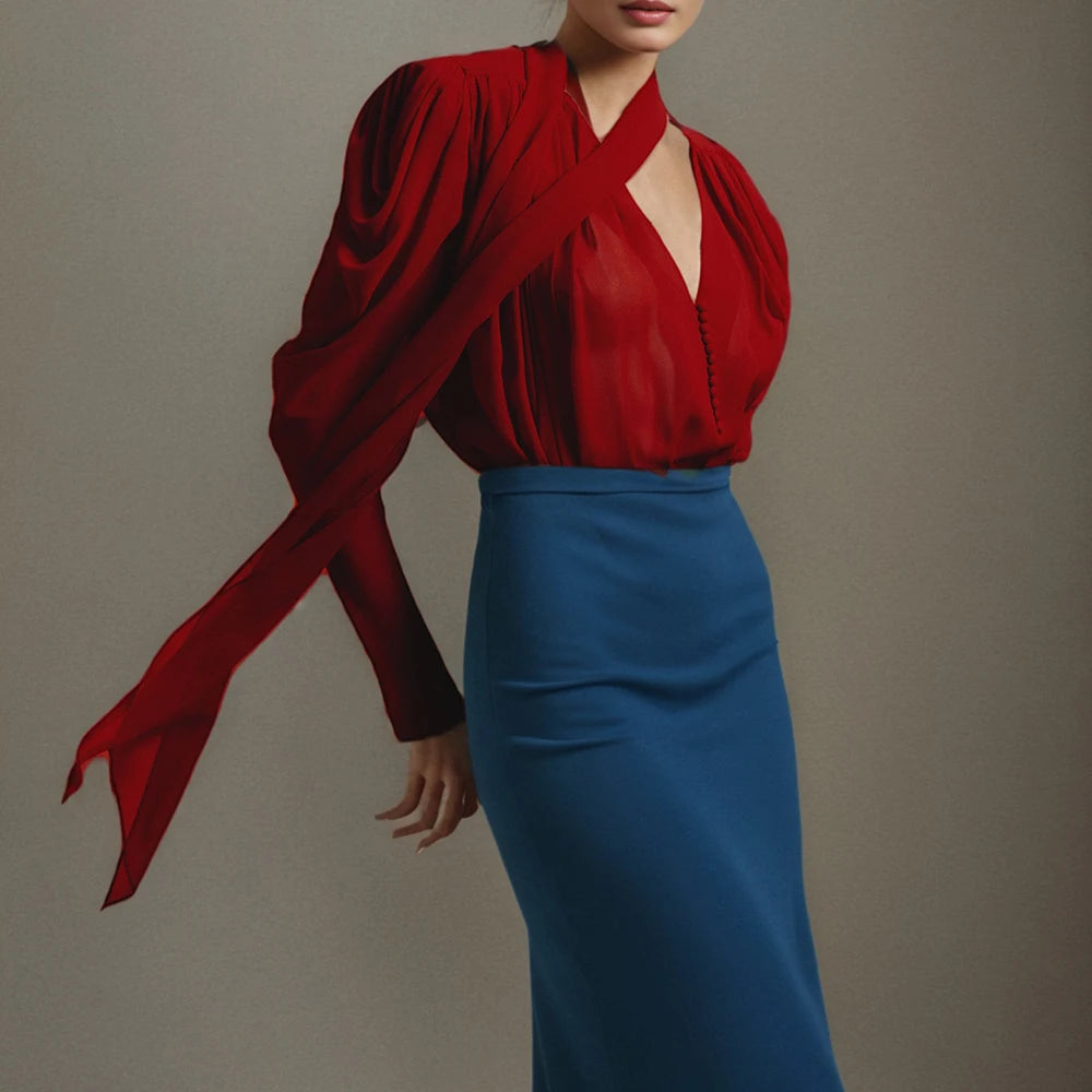 Model wearing a red mesh tie-up sleeve blouse styled with a fitted skirt, highlighting the V-neckline and clean drape.