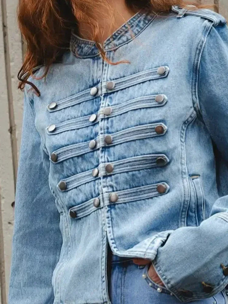 Close view of button detailing on a structured short jacket