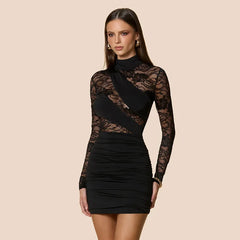 Close-up of ruched waist detailing on a sparkle mini dress