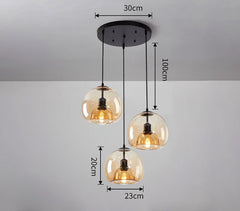 Three pendant ceiling lights with a black frame and clear glass shades, with dimensions.